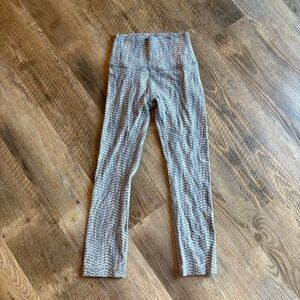Lululemon high-waisted grey leggings with a unique pattern